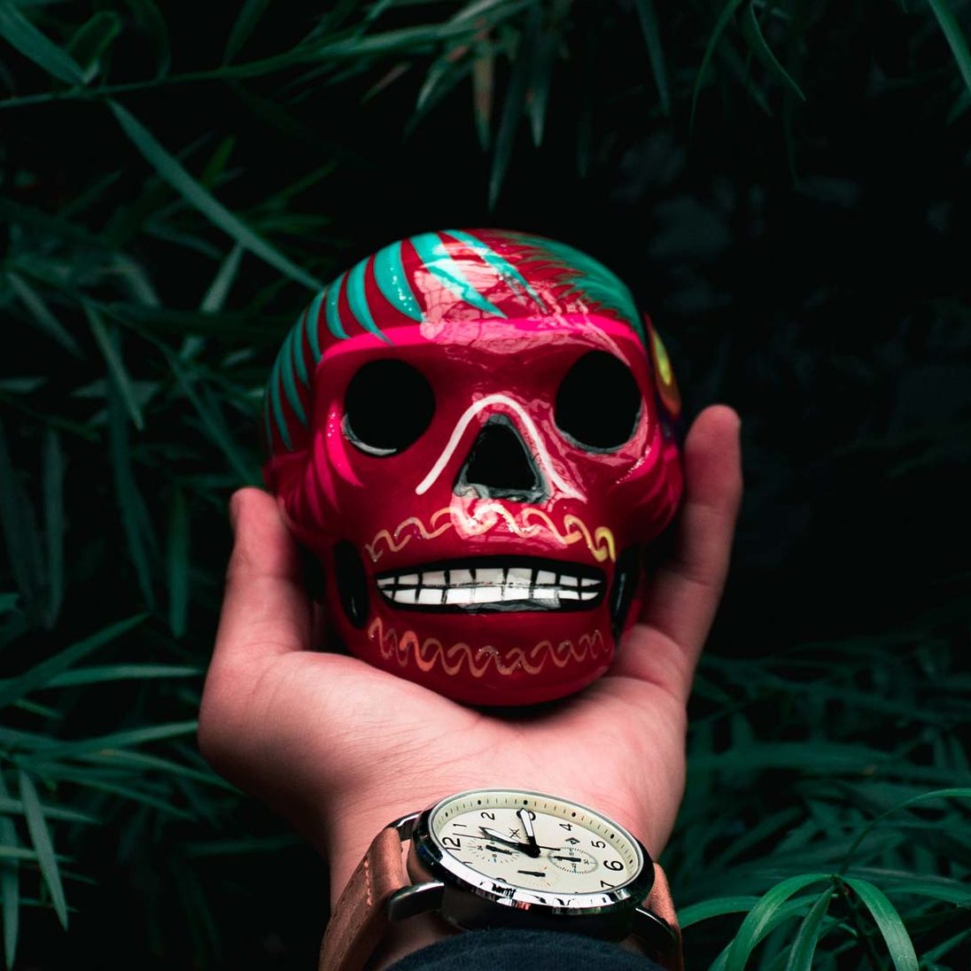 Hand Holding a Calavera Panteoncito School